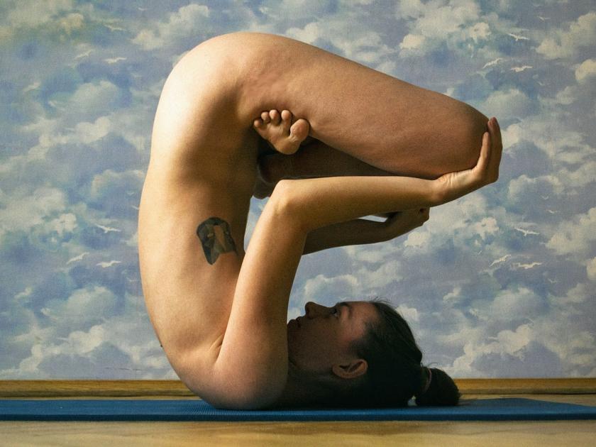 Naked yoga on clouds